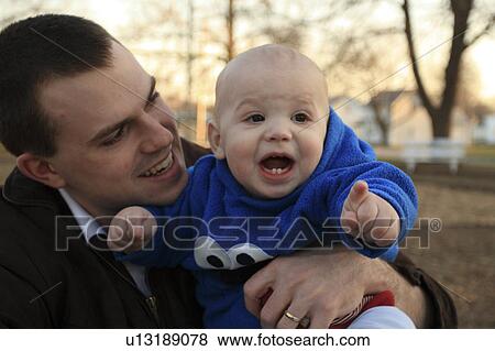 family baby love childhood discover excitement View Large Photo Image Stock Photo - family baby love childhood discover excitement. Fotosearch