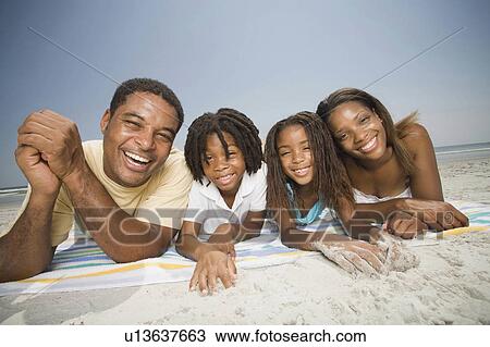 Stock Image -  family beach people children father mother 30s. Fotosearch