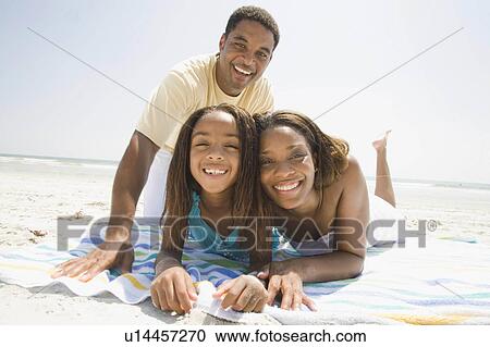 Stock Image -  family beach people girl child father mother 30s. Fotosearch