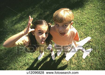 family girl children kids making funny faces 5-6 View Large Photo Image Stock Photo - family girl children kids making funny faces 5-6. Fotosearch