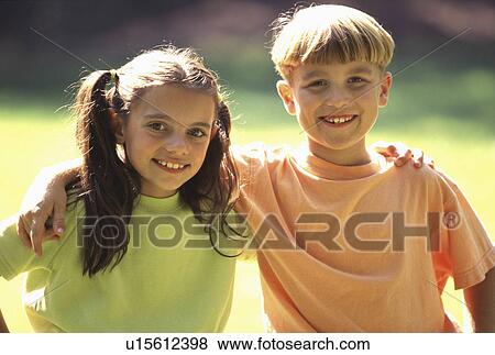 Stock Photo -  family girl children young boy standing outside. Fotosearch
