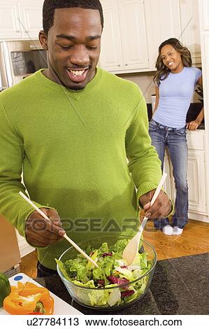food people couple in kitchen making salad 20-25 View Large Photo Image Stock Image - food people couple in kitchen making salad 20-25. Fotosearch