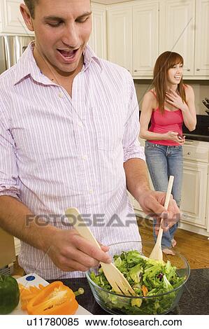 food people couple in kitchen making salad 20-25 View Large Photo Image Stock Photography - food people couple in kitchen making salad 20-25. Fotosearch
