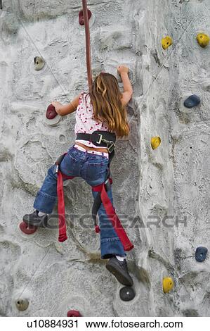 Stock Image -  girl sport young fair in usa climbing rock wall. Fotosearch