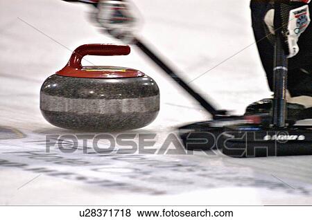 Stock Photo -  house close up image curling rock swept motion. Fotosearch