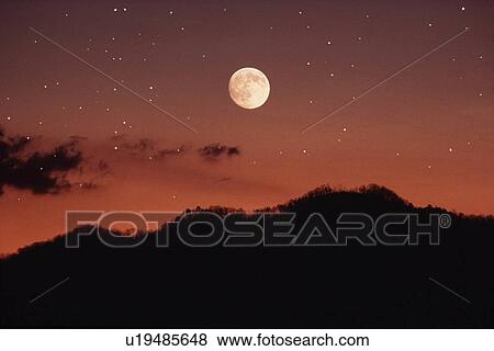 Stock Photo -  nature moon stars over smokey mountains north. Fotosearch