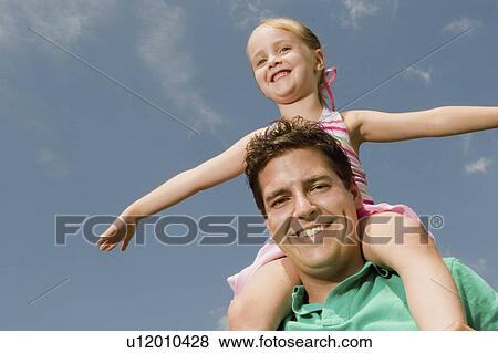 Stock Photo -  people child father daughter 30s, 35-40 years, 40-45. Fotosearch