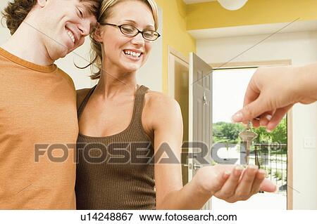 people couple beautiful young moving their new condo View Large Photo Image Stock Photo - people couple beautiful young moving their new condo. Fotosearch