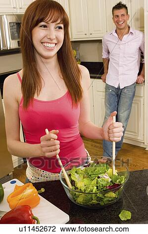 people couple in kitchen making salad 20-25 years View Large Photo Image Stock Image - people couple in kitchen making salad 20-25 years. Fotosearch