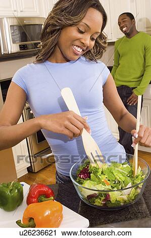 people couple in kitchen making salad 20-25 years View Large Photo Image Stock Image - people couple in kitchen making salad 20-25 years. Fotosearch
