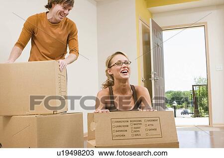 Stock Image -  people house couple home moving day 20s, 25-30, 30s. Fotosearch