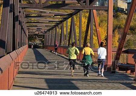 people joggers pedestrian bridge crossing north View Large Photo Image Stock Image -  people joggers pedestrian bridge crossing north. Fotosearch