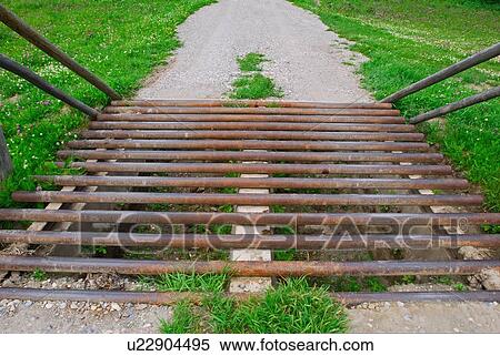 steel pole gate placed in roadway keep livestock View Large Photo Image Stock Photography - steel pole gate placed in roadway keep livestock. Fotosearch