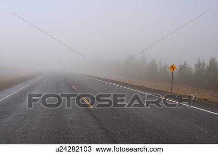 two lane blacktop highway streches mist fog damp View Large Photo Image Stock Image - two lane blacktop highway streches mist fog damp. Fotosearch