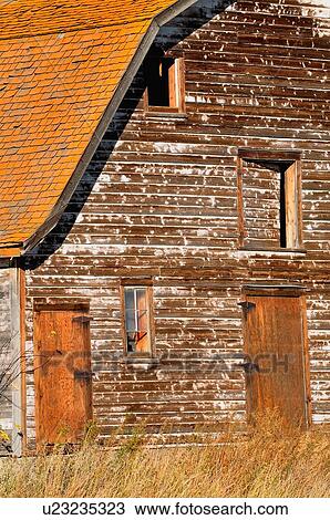 Stock Image -  vintage selected section front view old barn. Fotosearch