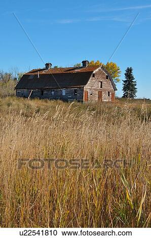 Stock Image -  vintage vertical landscape barn run down farm. Fotosearch