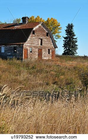 Stock Image -  vintage vertical landscape scenic barn run down. Fotosearch