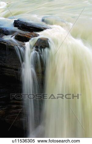 Stock Photography -  water athabasca river flowing over falls in park. Fotosearch