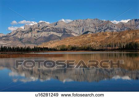 Stock Photo -  water autumn reflection miette mountain range . Fotosearch