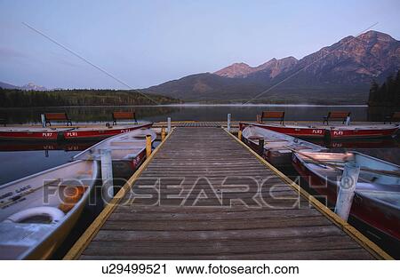 Stock Image -  water morning view pyramid lake in jasper park. Fotosearch