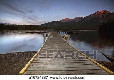 Stock Photo -  water pyramid lake docks boats benches moumtain. Fotosearch