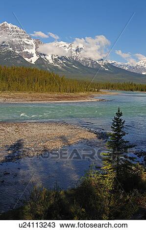 water vertical image snowcapped rocky mountains View Large Photo Image Stock Image - water vertical image snowcapped rocky mountains. Fotosearch