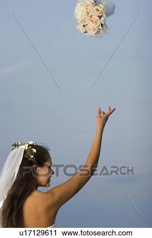 Stock Image -  wedding woman beach flowers people couple person. Fotosearch