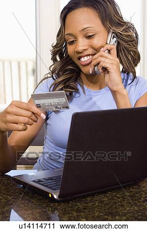 Stock Image -  woman computer internet person buying items 25-30. Fotosearch