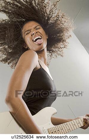 woman girl beautiful young dancing playing rock View Large Photo Image Picture - woman girl beautiful young dancing playing rock. Fotosearch