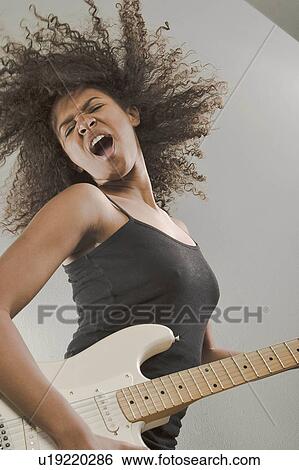woman girl beautiful young dancing playing rock View Large Photo Image Stock Photograph - woman girl beautiful young dancing playing rock. Fotosearch