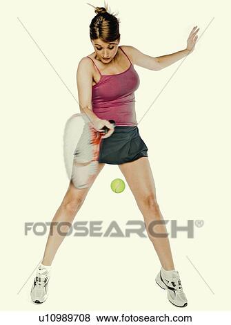 Stock Photo -  woman girl person young playing tennis hitting. Fotosearch