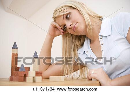 Picture -  woman junge frau mit baukletzen young brick 25-30. Fotosearch