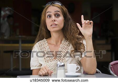 Stock Photo -  woman madchen im young coffeeshop model released. Fotosearch