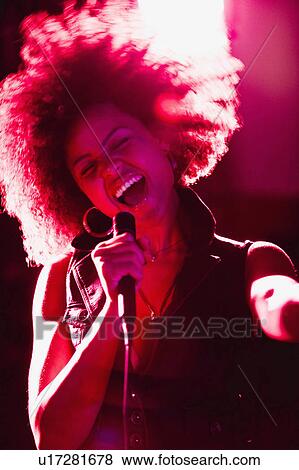woman music person young singing microphone 20-25 View Large Photo Image Stock Photo - woman music person young singing microphone 20-25. Fotosearch