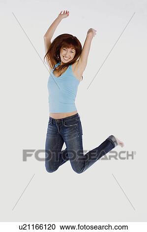 woman person happy jumping 20-25 years 20s, 25-30 View Large Photo Image Stock Image - woman person happy jumping 20-25 years 20s, 25-30. Fotosearch