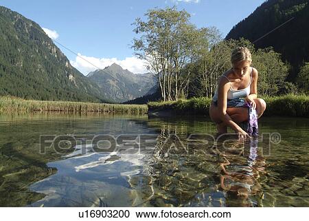 Stock Image -  woman water people summer nature wellness styria. Fotosearch