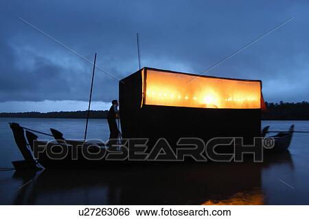 art tholpava koothu boat monsoon in river blue View Large Photo Image Stock Photograph - art tholpava koothu boat monsoon in river blue. Fotosearch