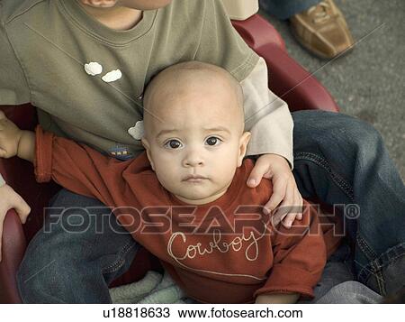 Stock Image -  baby child face home adoreable toddler looking. Fotosearch