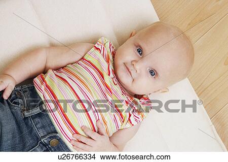 Picture -  baby child high angle view boy lying pillow 12-15. Fotosearch