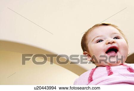 Picture -  baby girl child closeup smiling 12-15 months hair. Fotosearch