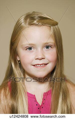 Stock Photo -  background girl child closeup smiling 6-7 years. Fotosearch