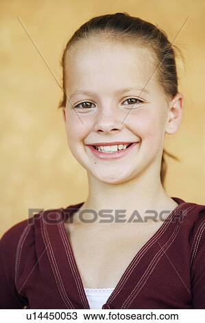 Stock Image -  background girl closeup teenage smiling 13-14. Fotosearch