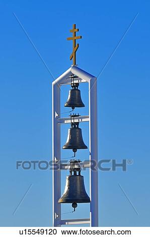 Stock Image -  background vertical image three brass bells . Fotosearch