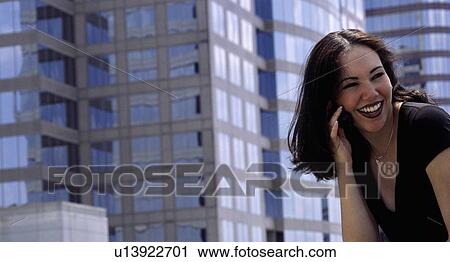 Stock Image -  background woman technology talking cell phone. Fotosearch