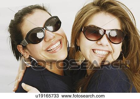 background women closeup two young hugging 20-24 View Large Photo Image Stock Image - background women closeup two young hugging 20-24. Fotosearch
