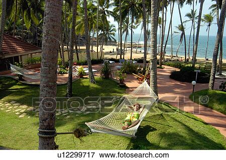 Stock Photo -  beach coconut bay resort kovalam chowara resorts. Fotosearch