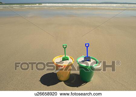 beach sand pails beaches bucket buckets coast View Large Photo Image Stock Image - beach sand pails beaches bucket buckets coast. Fotosearch