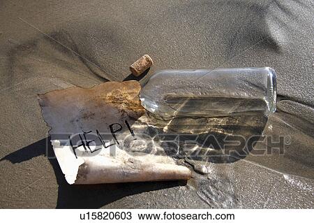 Stock Image -  beach water generic message in bottle theme help. Fotosearch