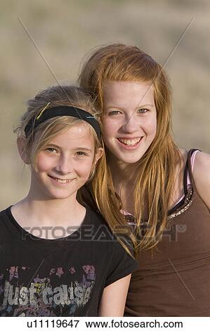 beauty two 2 young girls posing outside canada View Large Photo Image Stock Photo - beauty two 2 young girls posing outside canada. Fotosearch