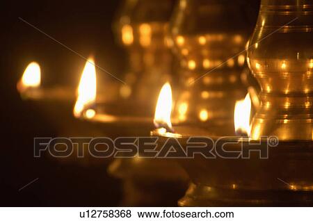 brass oil lamps kerala glowing lustrous golden View Large Photo Image Stock Photo - brass oil lamps kerala glowing lustrous golden. Fotosearch